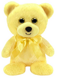 Yellow teddy bear with a bow on a white background